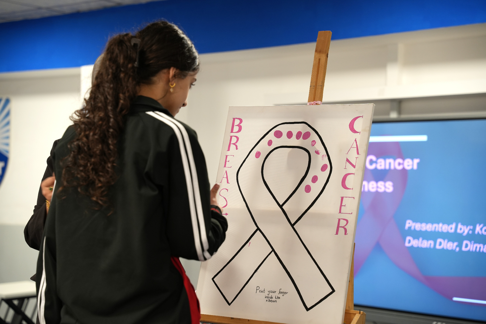 Students and staff wearing pink for the school breast cancer awareness day