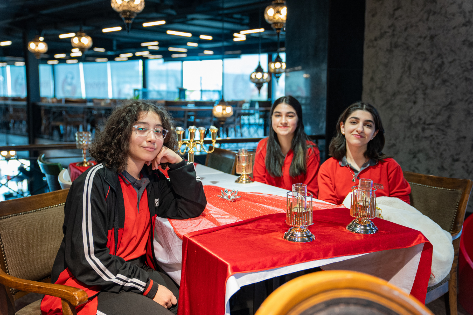Students sitting down to a meal together on a class trip to Today Restaurant