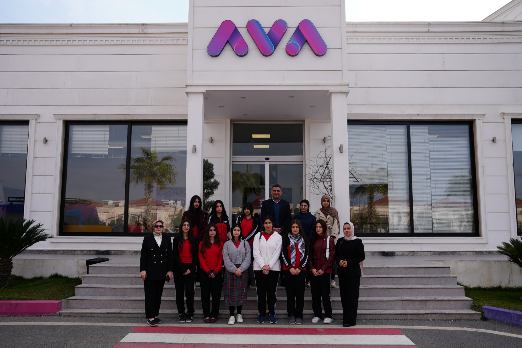 AVA Media presenters filming and talking with Zhyar students during their visit to the school