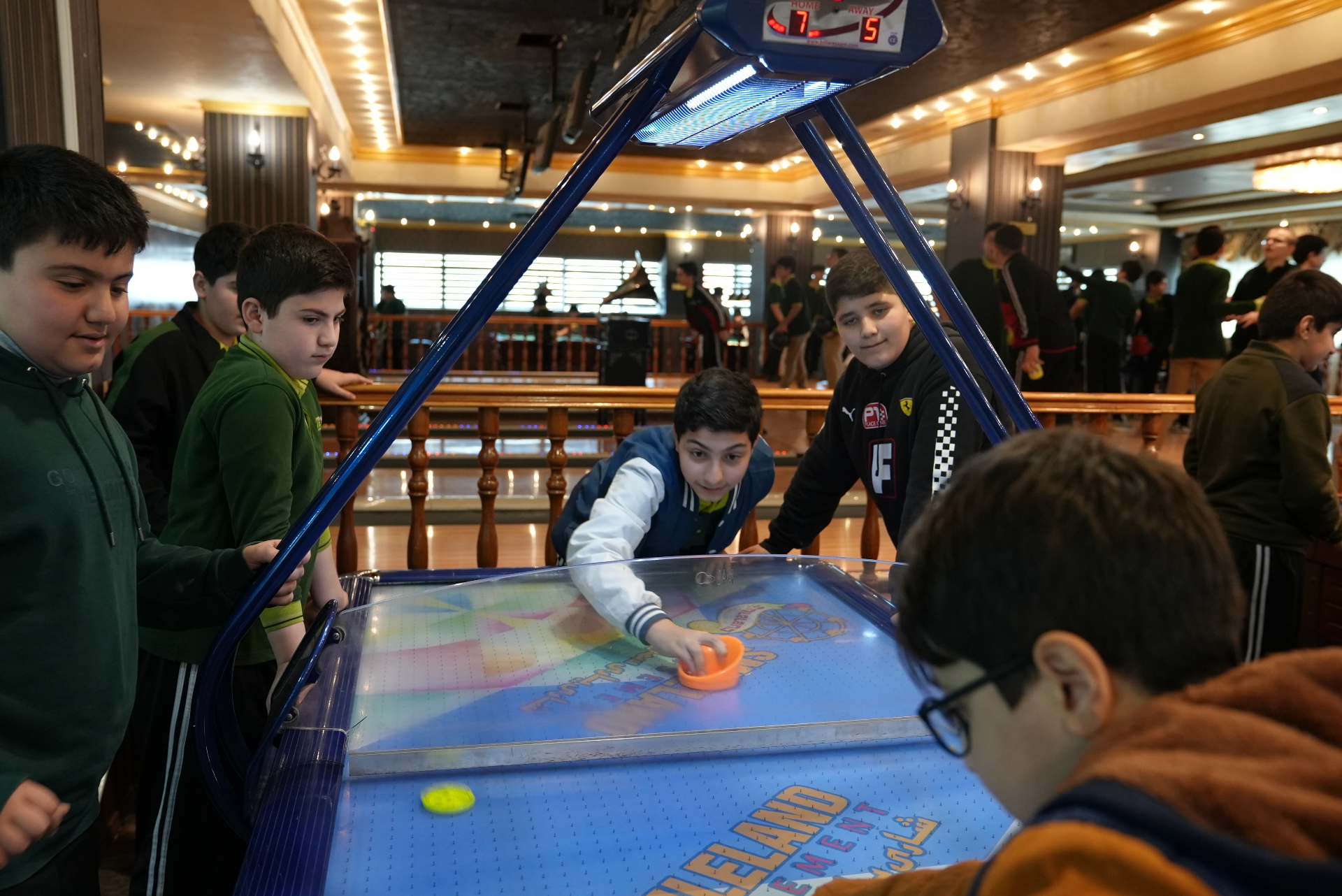 Younger students playing on the rides during a class visit to Smileland