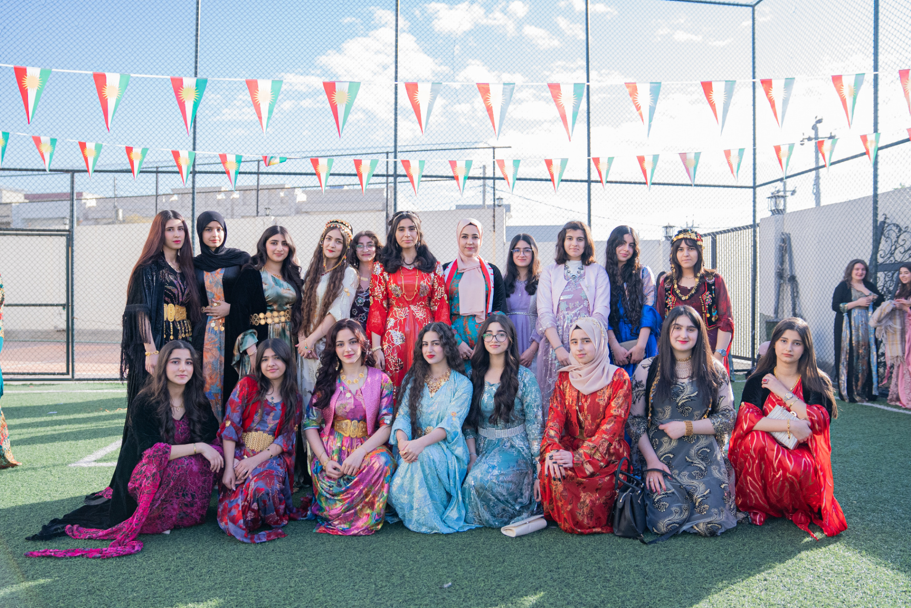 Students wearing colourful traditional Kurdish clothes for Kurdish Clothes Day