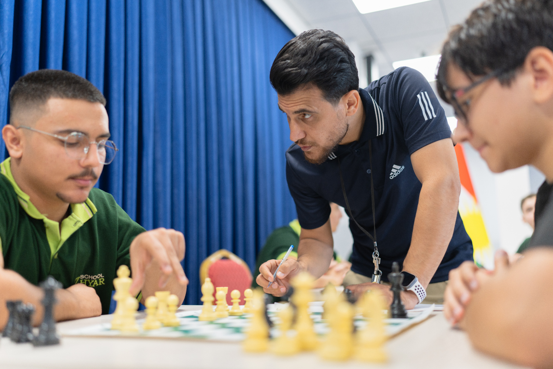 Boys concentrating over chess boards during the inter-class chess tournament